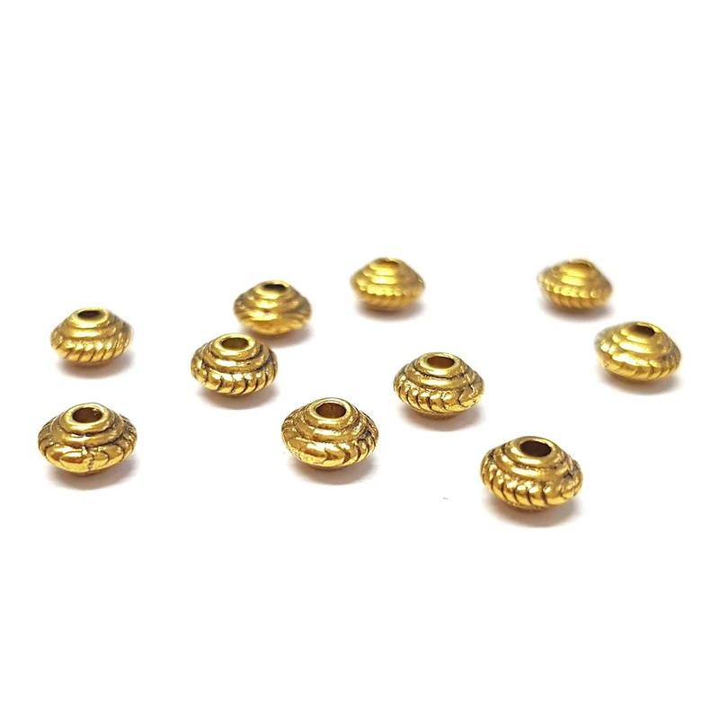 Perles metal toupie 5 x 3 mm doré