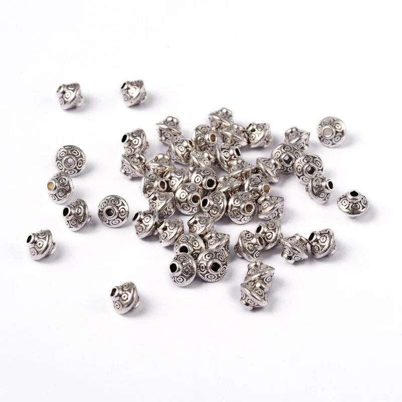 Perles toupie tibétaines en métal 6.5 x 7 mm