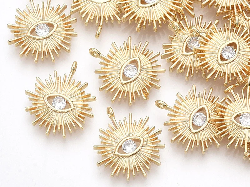 Breloque dorée à l'or fin 18K – Soleil avec œil strass blanc