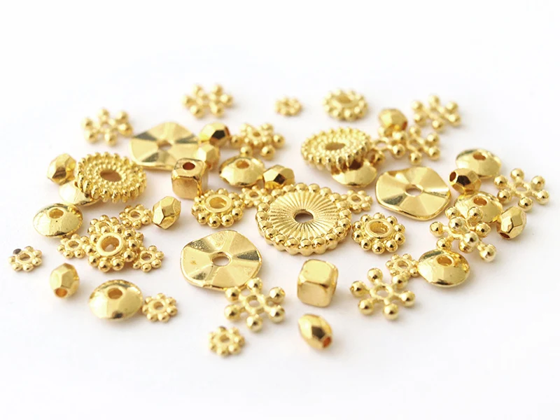 Lot de 10 grammes soit 40 pcs env d'intercalaires dorées pour perles heishi