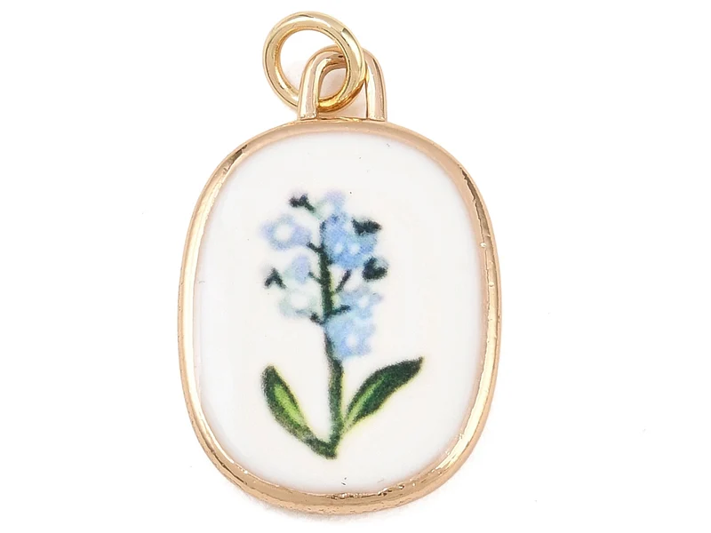 Breloque ovale fleur bleue - laiton doré clair