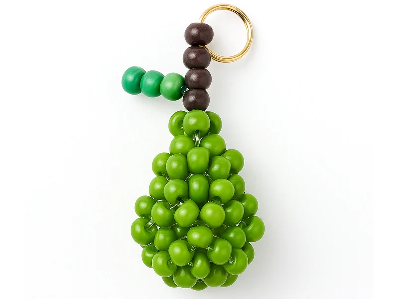 Breloque poire verte en perles de verre