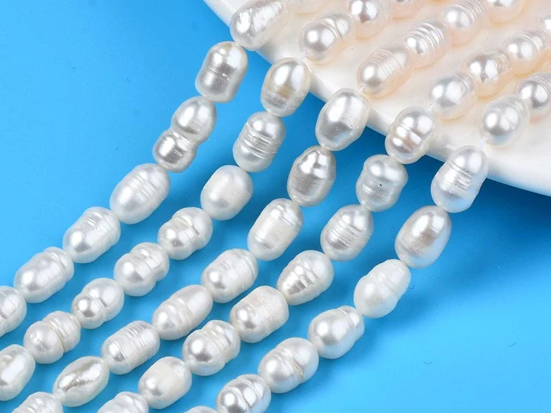 20 perles de culture forme grain de riz - 10 mm env