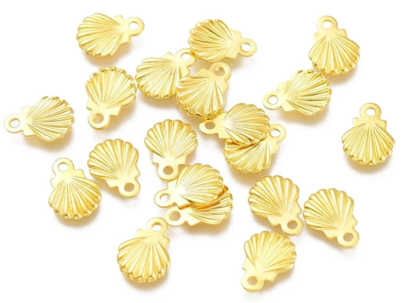 10 mini breloques / pendentifs mini coquillages - 7,5 mm - acier inoxydable doré