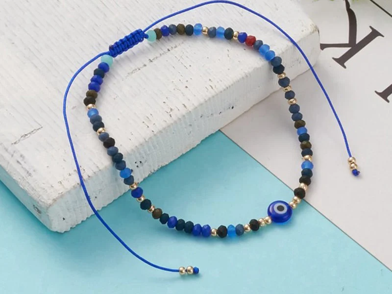 Bracelet perles œil bleu - porte bonheur - taille ajustable