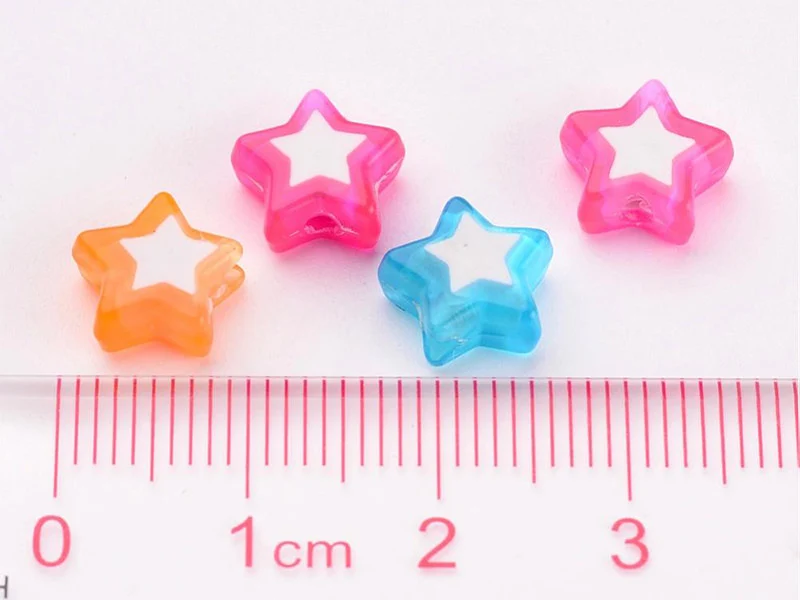 50 perles en plastique étoiles - transparent et blanc - 9x10 mm