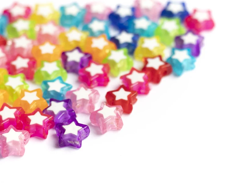 50 perles en plastique étoiles - transparent et blanc - 9x10 mm