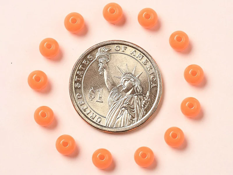 100 perles en plastique rondes 6 mm - orange fluo