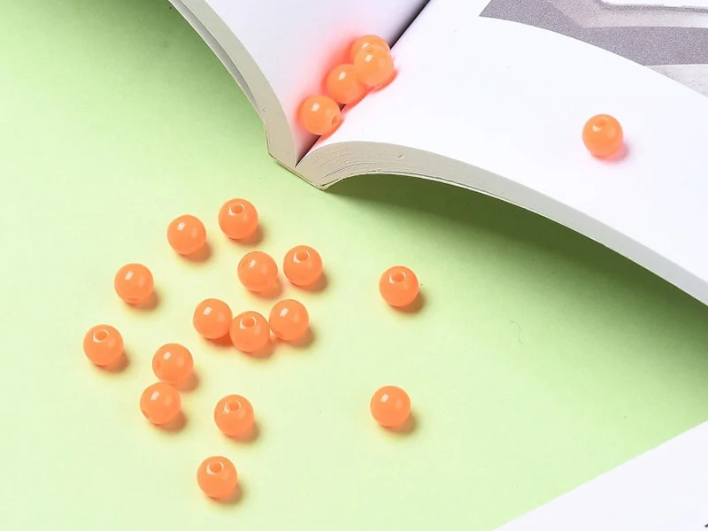100 perles en plastique rondes 6 mm - orange fluo