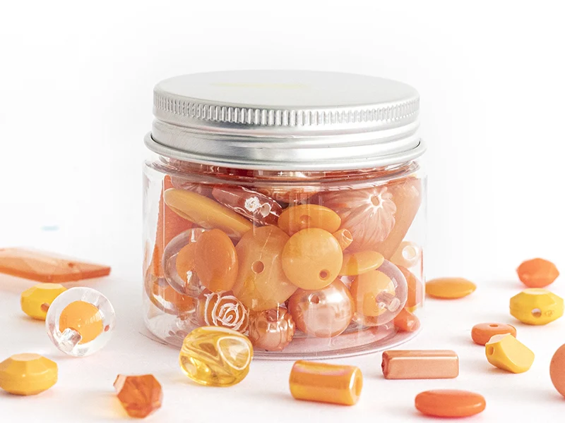 Pot de perles en plastique - nuances d'orange