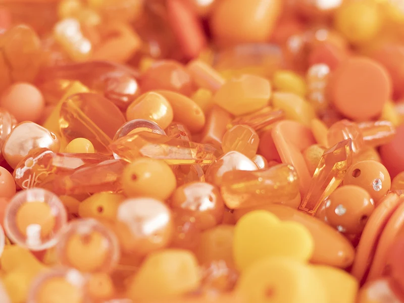 Pot de perles en plastique - nuances d'orange
