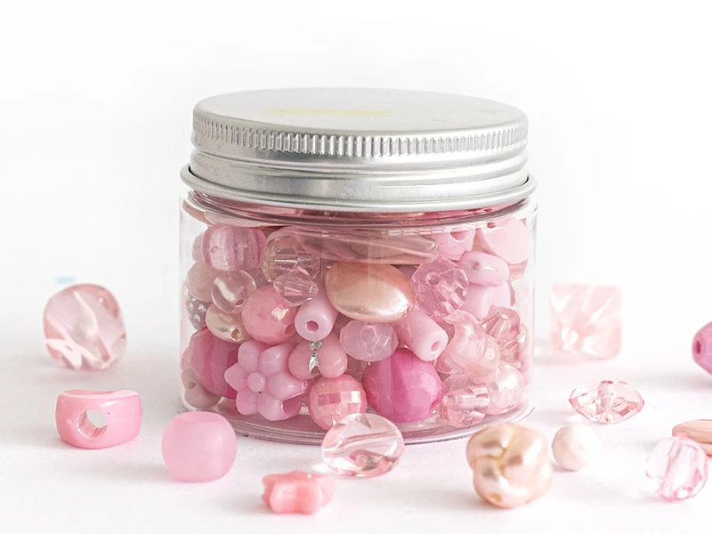 Pot de perles en plastique - nuances de rose