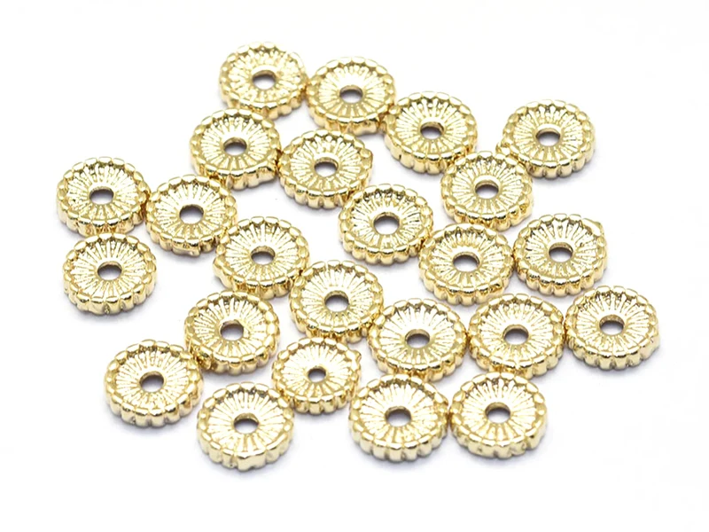 Perle rondelle ethnique 7 x 1,5 mm - dorée à l'or fin