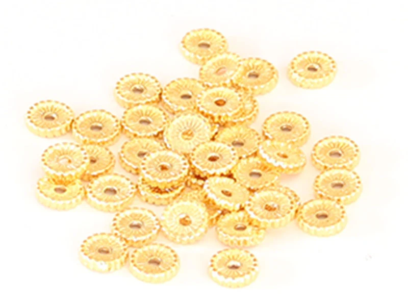 Perle rondelle ethnique 7 x 1,5 mm - dorée à l'or fin