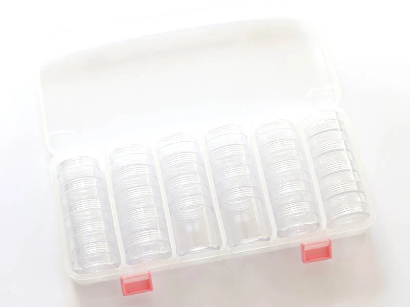 Mallette de rangement avec ses 28 boites rondes