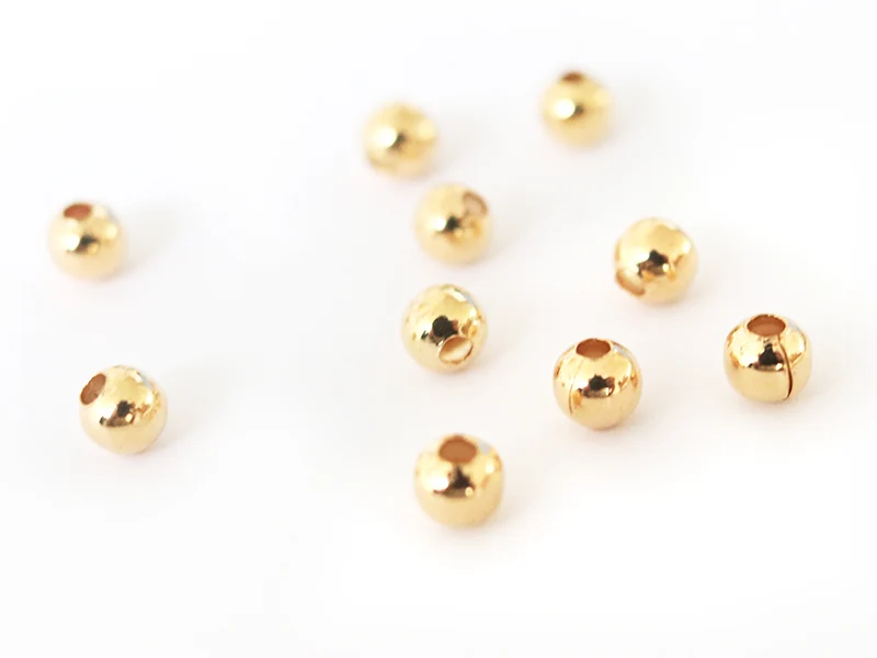 Lot de 50 perles rondes 4mm - dorées à l'or fin